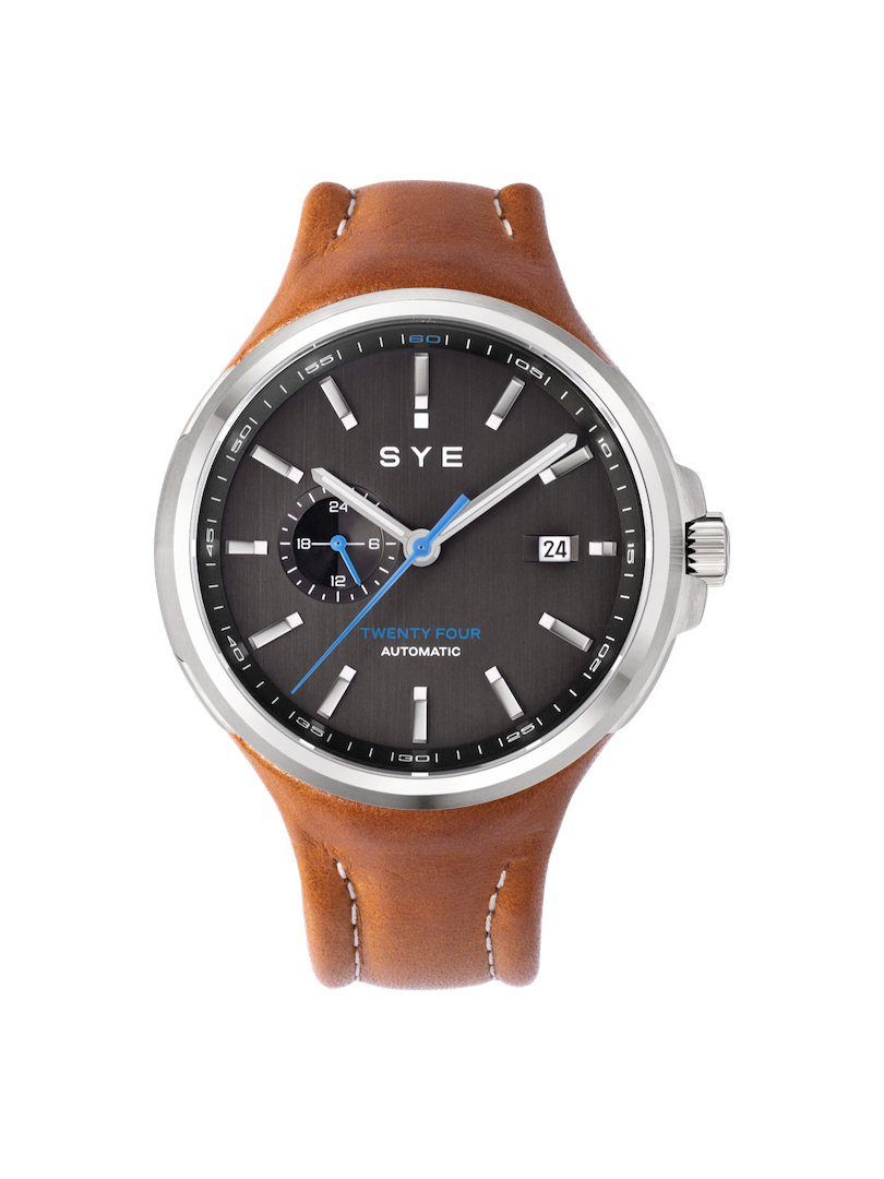 SYE watch with brown leather strap and black dial on a white background