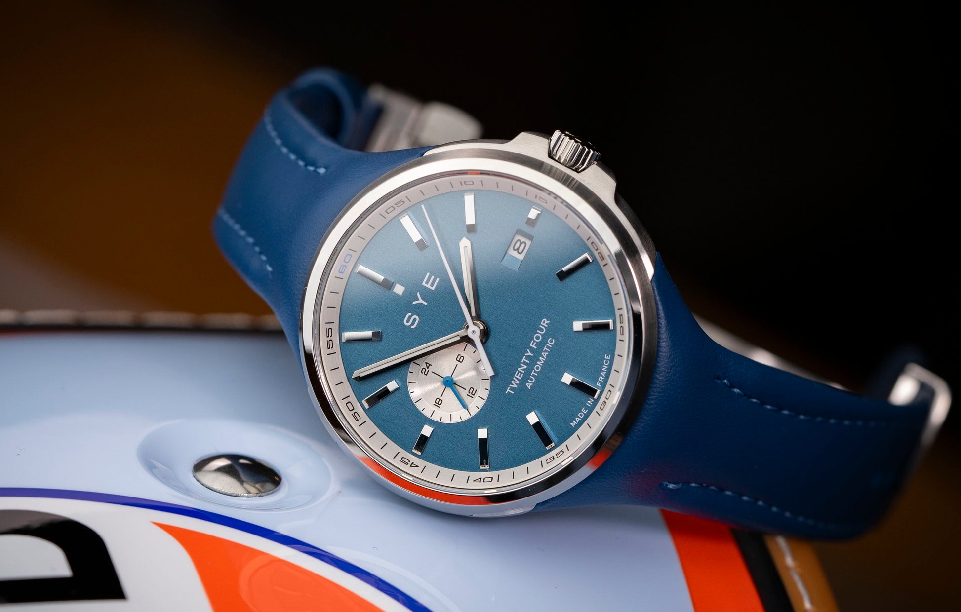 Watch with blue strap and blue face on a blurred background
