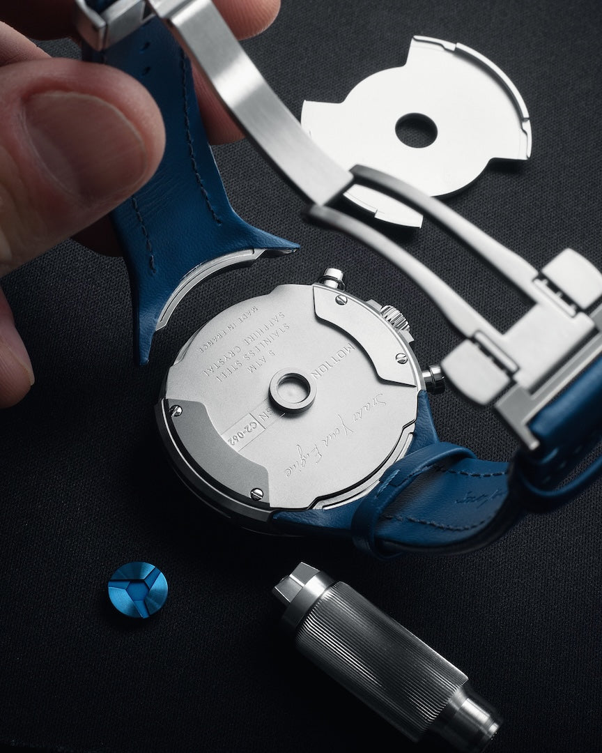 Watch mechanism and tools on a dark surface