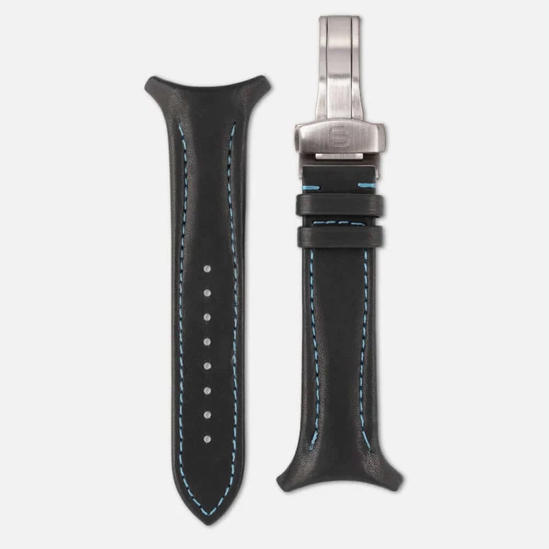 Black leather watch strap with silver clasp on a white background