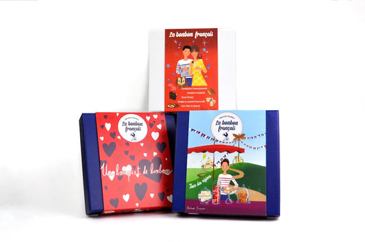 Three different boxes of French candies, each with a colorful and thematic design, part of the 'Trio of boxes' product.