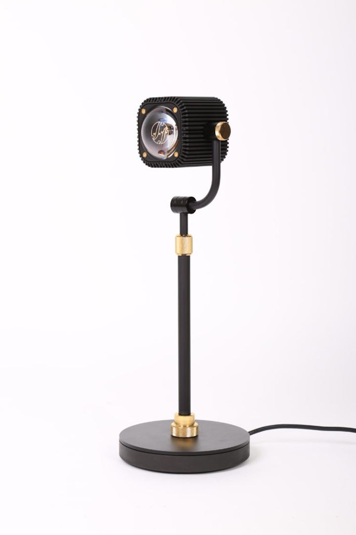 Black and gold table lamp on a white background