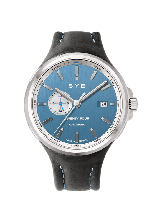 SYE watch with blue dial and black leather strap on a white background