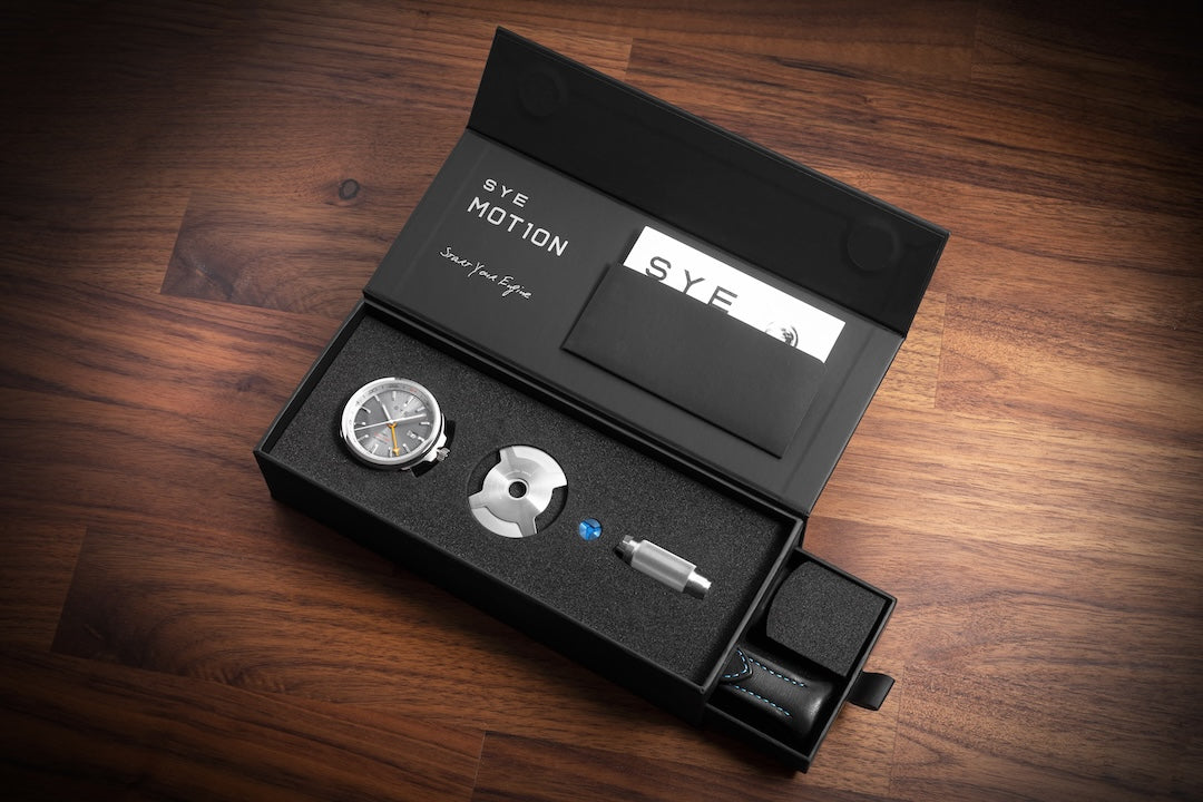 S.Y.E Motion watch set in a black box on a wooden surface
