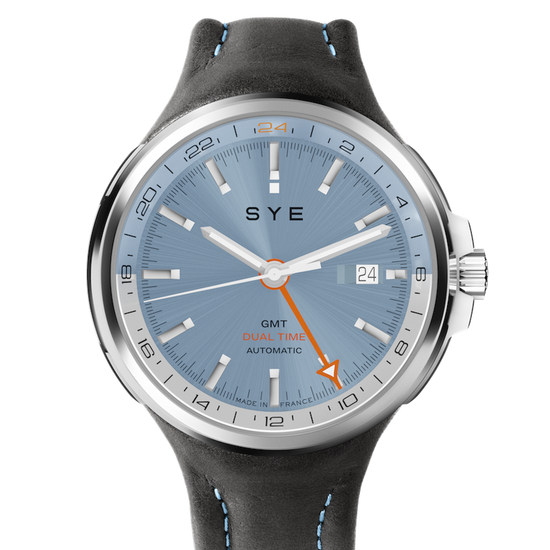 Watch with blue dial and gray strap on a white background