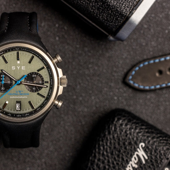 SYE watch with leather strap on a textured surface