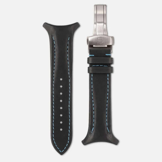 Black leather watch strap with silver clasp on a white background