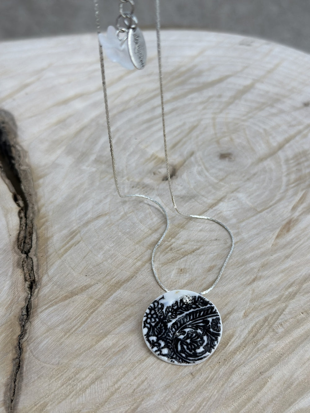 Porcelain locket with Black arabesque imprint N.4