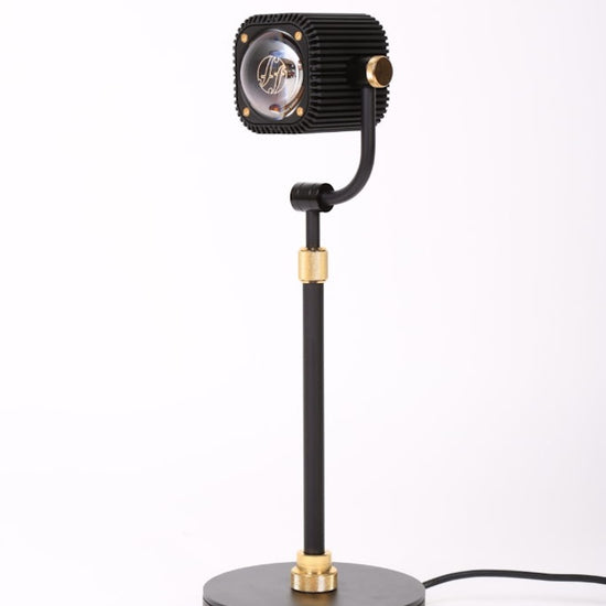 Black and gold table lamp on a white background