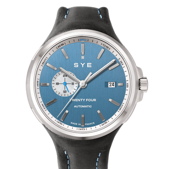 SYE watch with blue dial and black leather strap on a white background