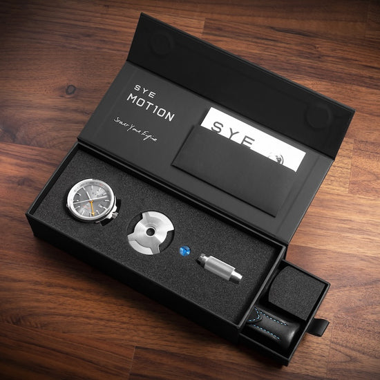 S.Y.E Motion watch set in a black box on a wooden surface